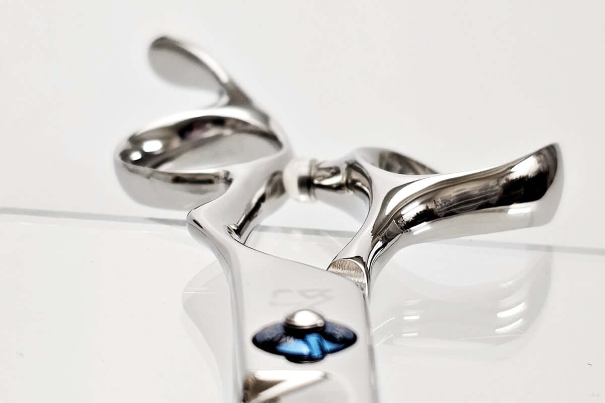 Close-up of hair scissor handle on a white background