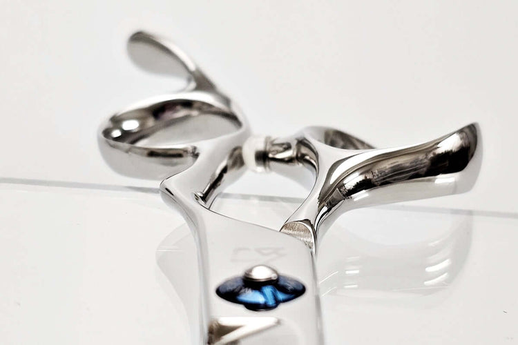 Close-up of hair scissor handle on a white background