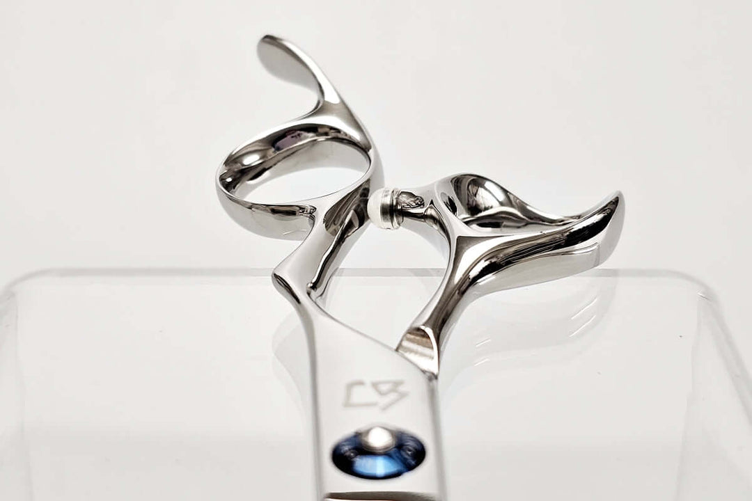 Close-up of Michiko scissors handles on a white background