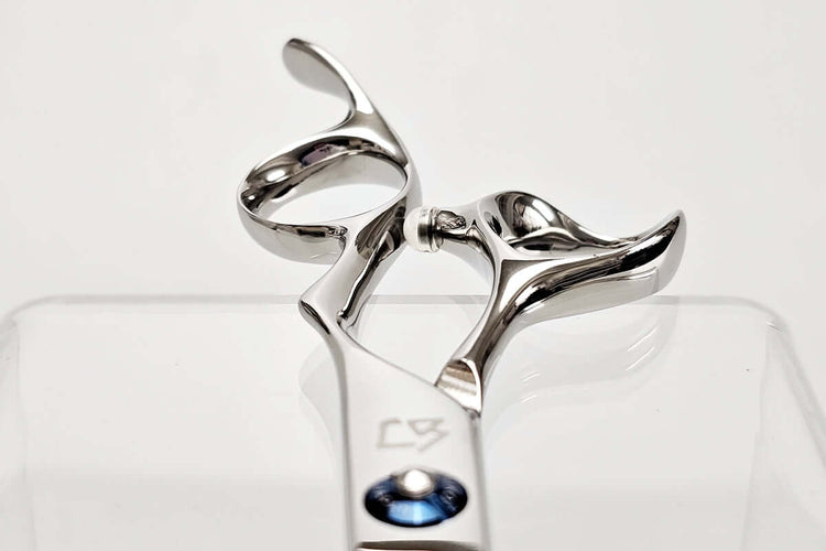Close-up of Michiko scissors handles on a white background