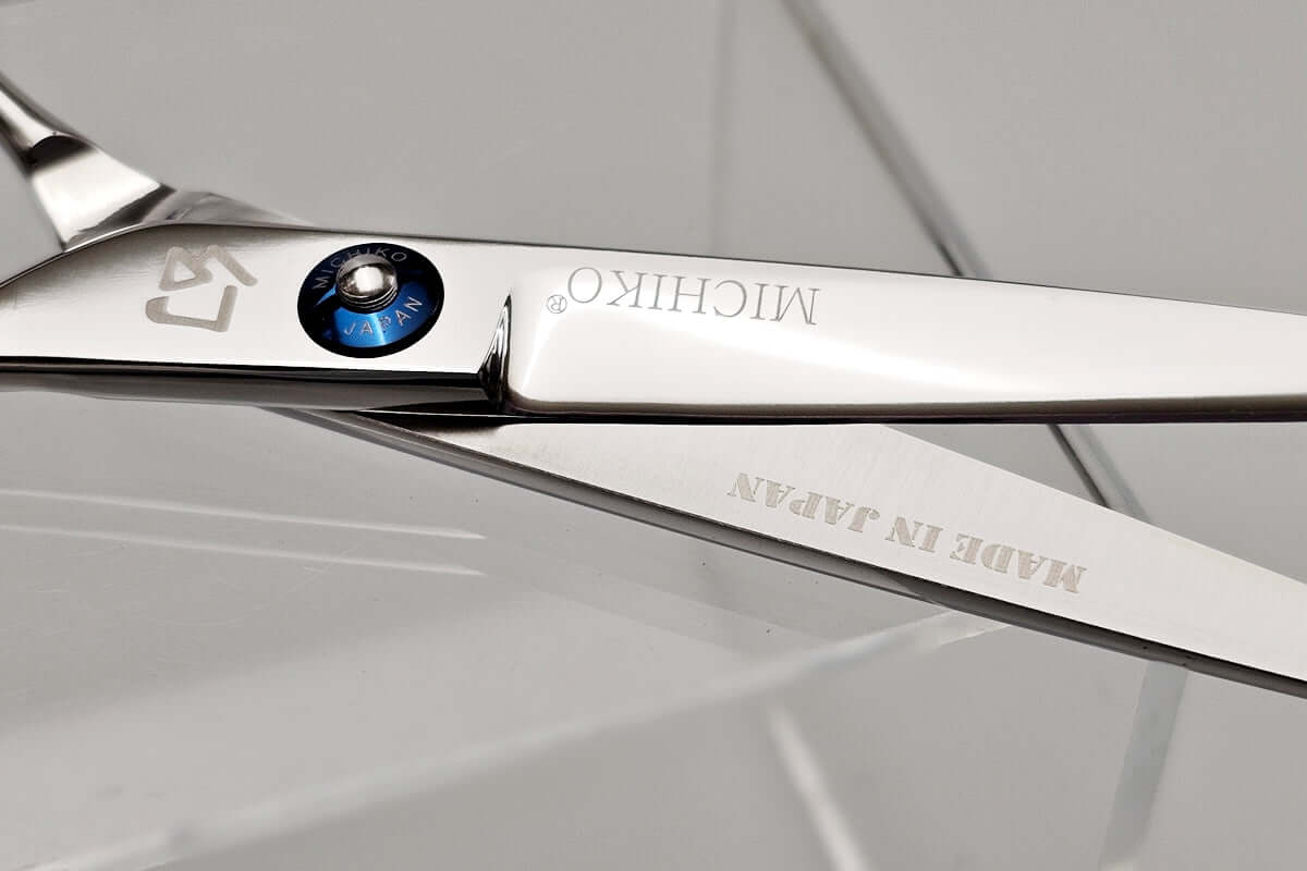 Close-up of a pair of Michiko scissors with 'Made in Japan' text on a gray background