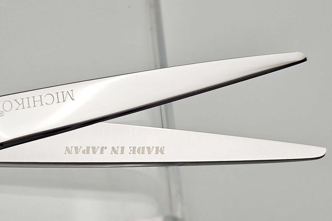 Close-up of a pair of Michiko scissors with 'Made in Japan' text on a white background