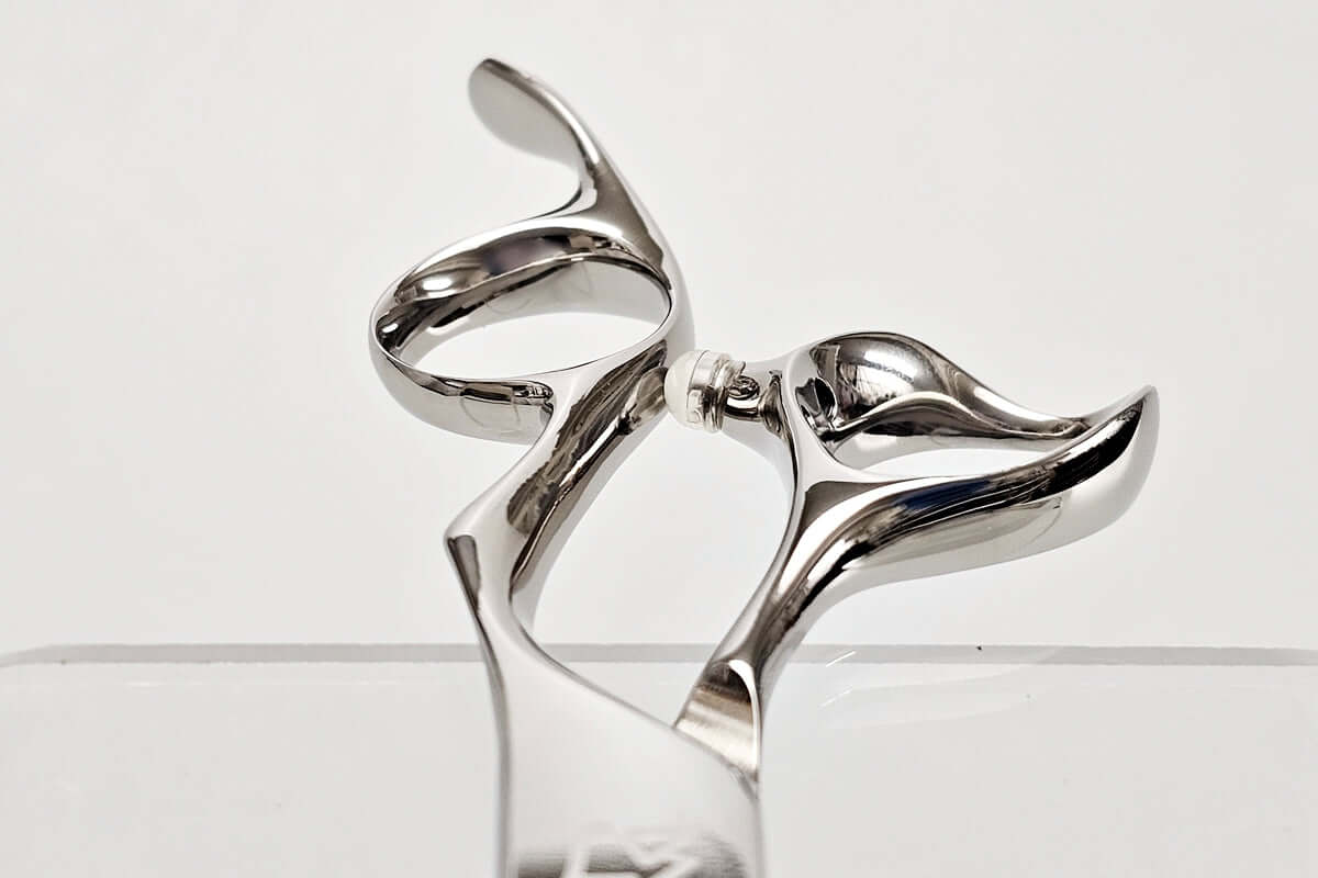 Close-up of hair scissors handles on a white background