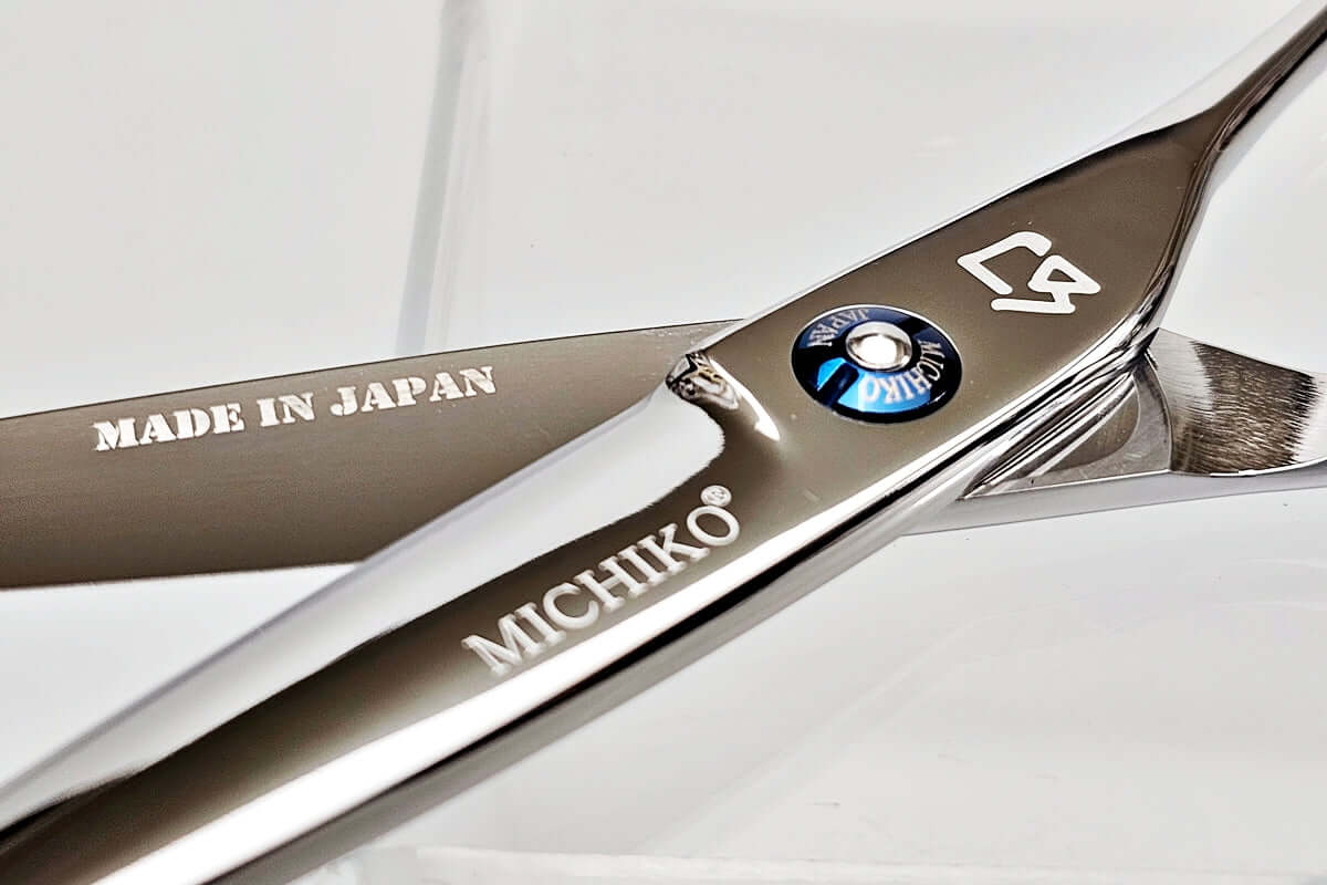 Hair cutting shears with 'Made in Japan' and 'Michiko' branding on a white background