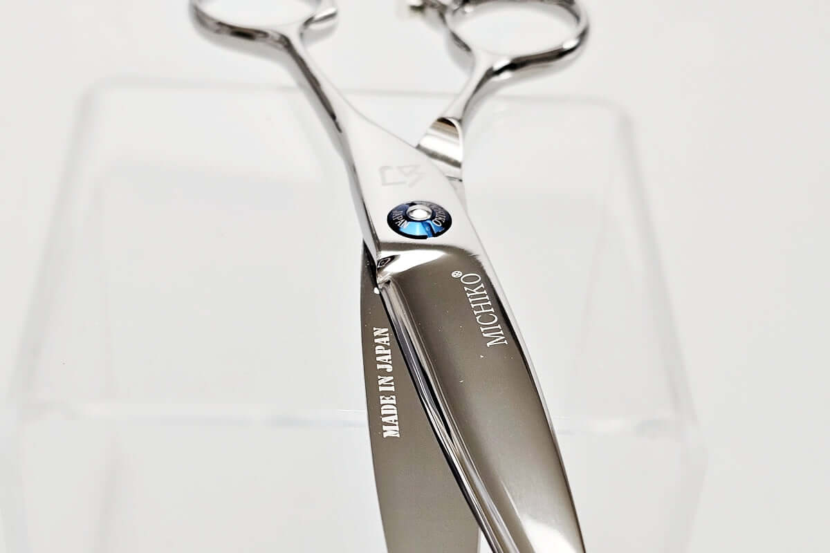 Silver scissors with 'MICHIKO' branding on a white background