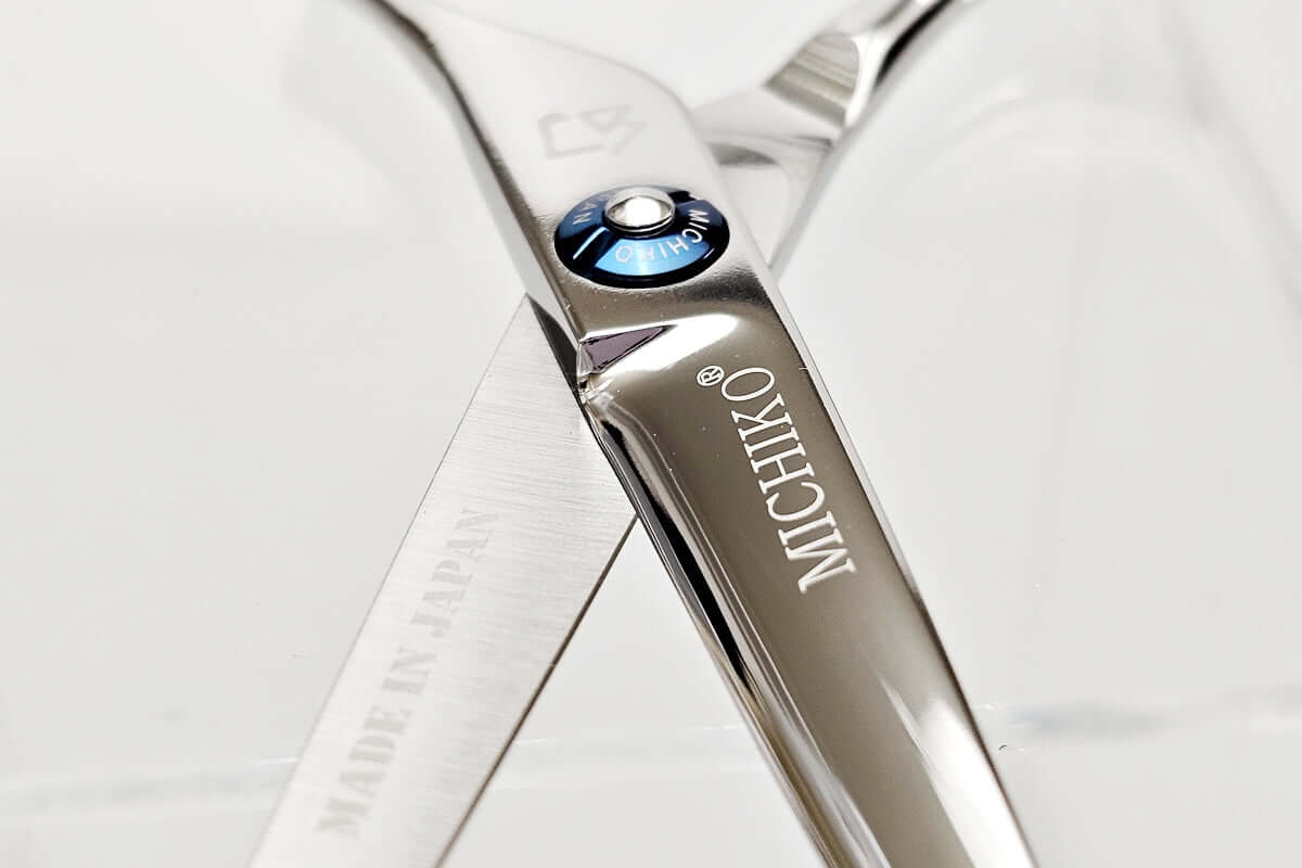 Close-up of a Michiko hair scissors on a white background