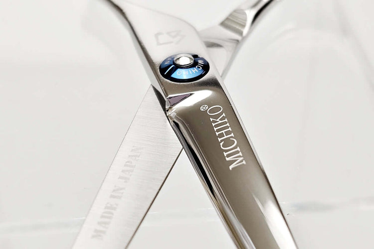 Close-up of a Michiko hair scissors on a white background