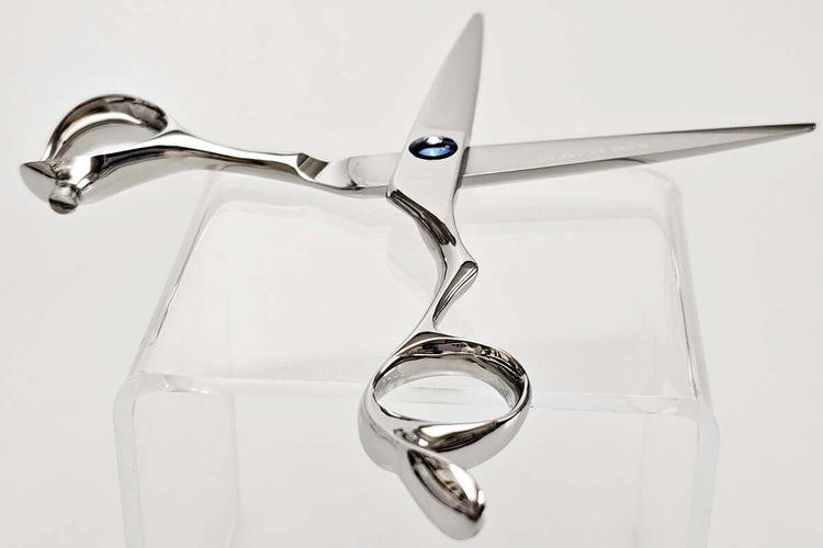 Silver hair scissors on a white background