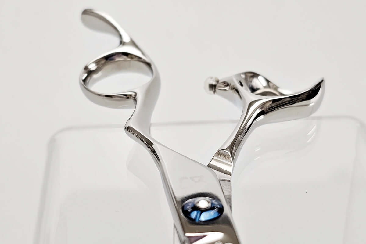 Close-up of a pair of hair scissors on a white background