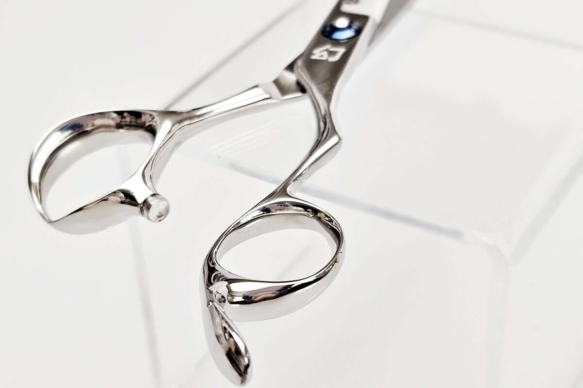 Close-up of a pair of hair scissors on a white background