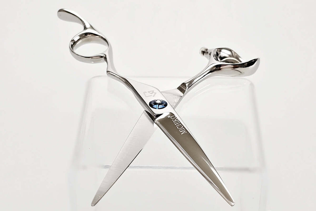 Hair scissors with a brand logo on a white background