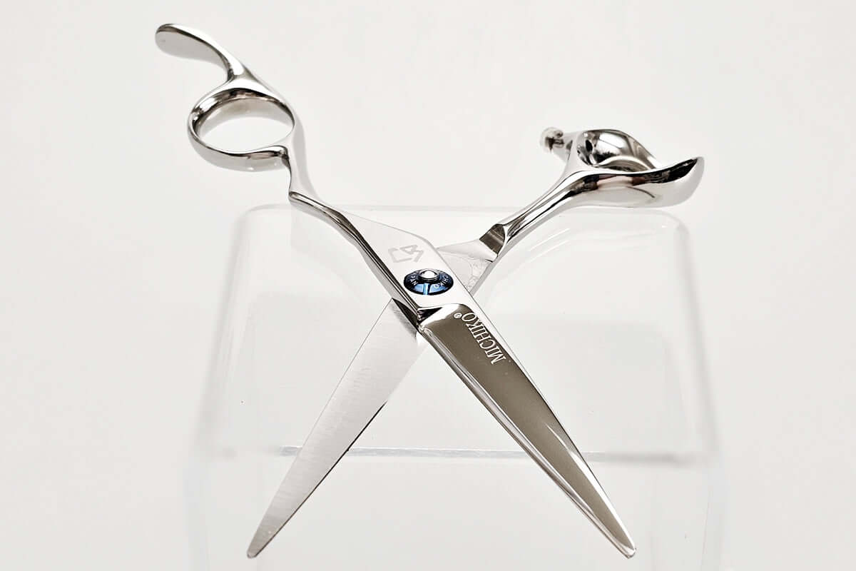 Hair scissors with a brand logo on a white background