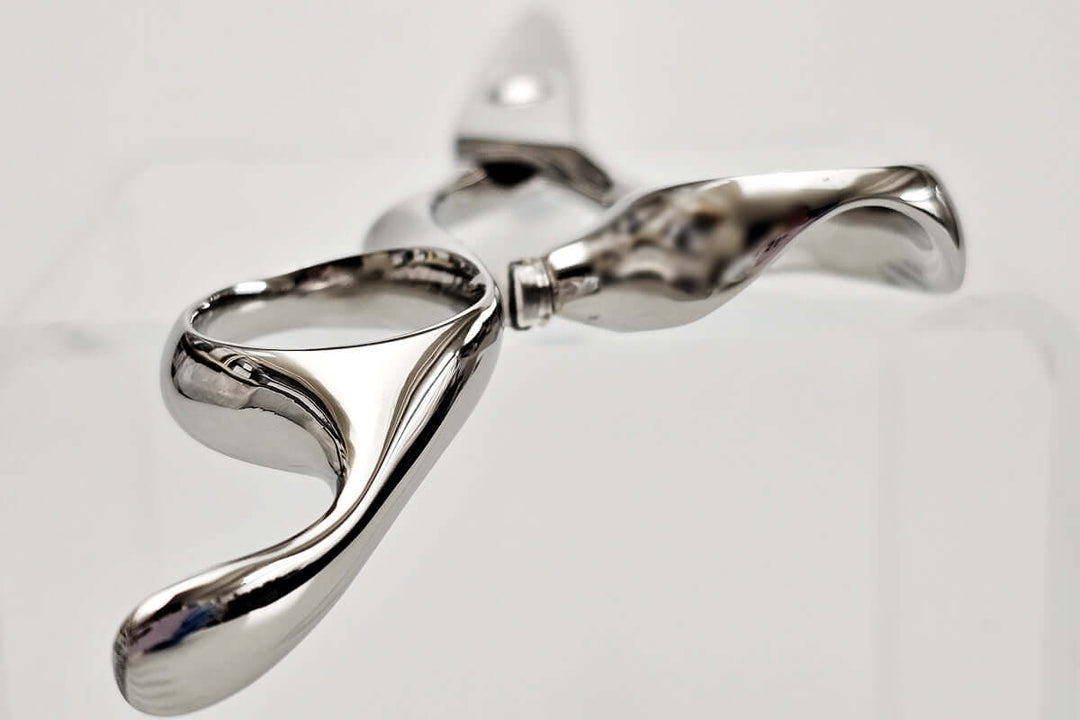 Close-up of hair scissors handle part on a light gray background