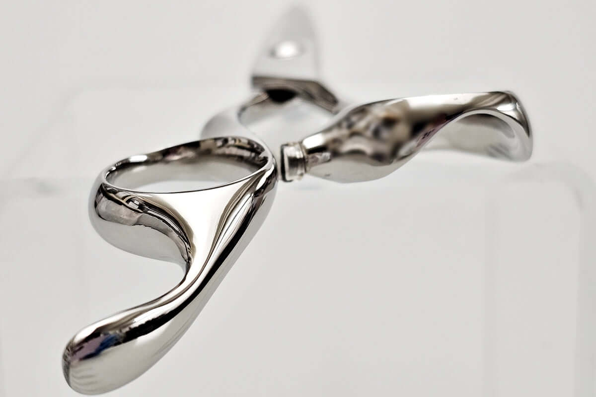 Close-up of hair scissors handle part on a light gray background