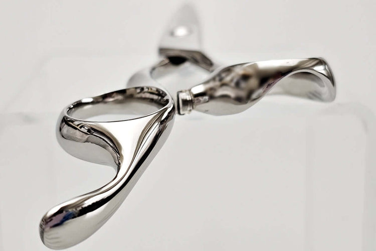 Close-up of hair scissors handle part on a light gray background