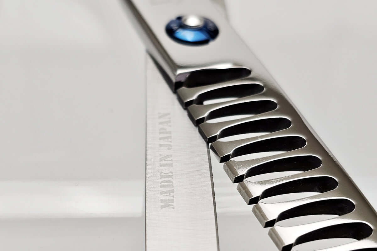 Close-up of hair texturizing shears with 'Made in Japan' text on a white background