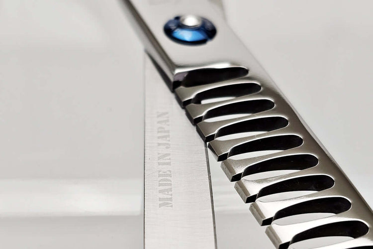Close-up of hair texturizing shears with 'Made in Japan' text on a white background