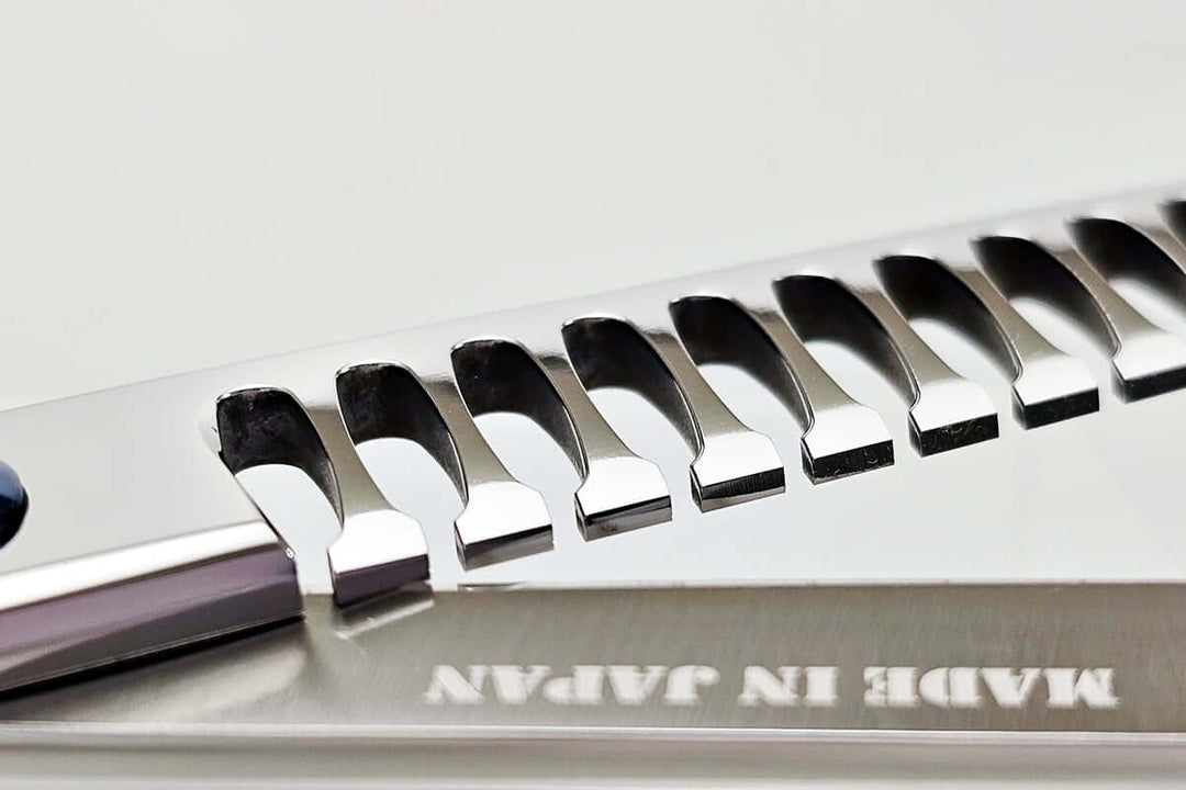 Close-up of hair texturizing shears with 'Made in Japan' text on a white background