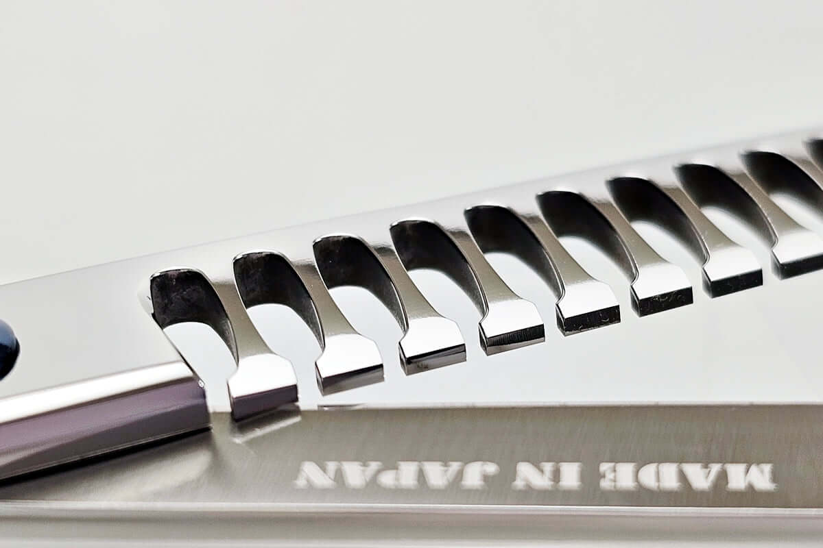 Close-up of hair texturizing shears with 'Made in Japan' text on a white background