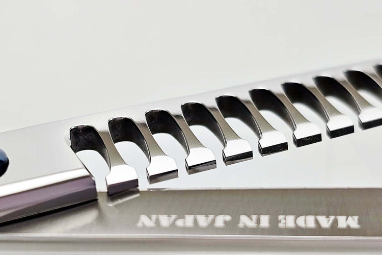 Close-up of hair texturizing shears with 'Made in Japan' text on a white background