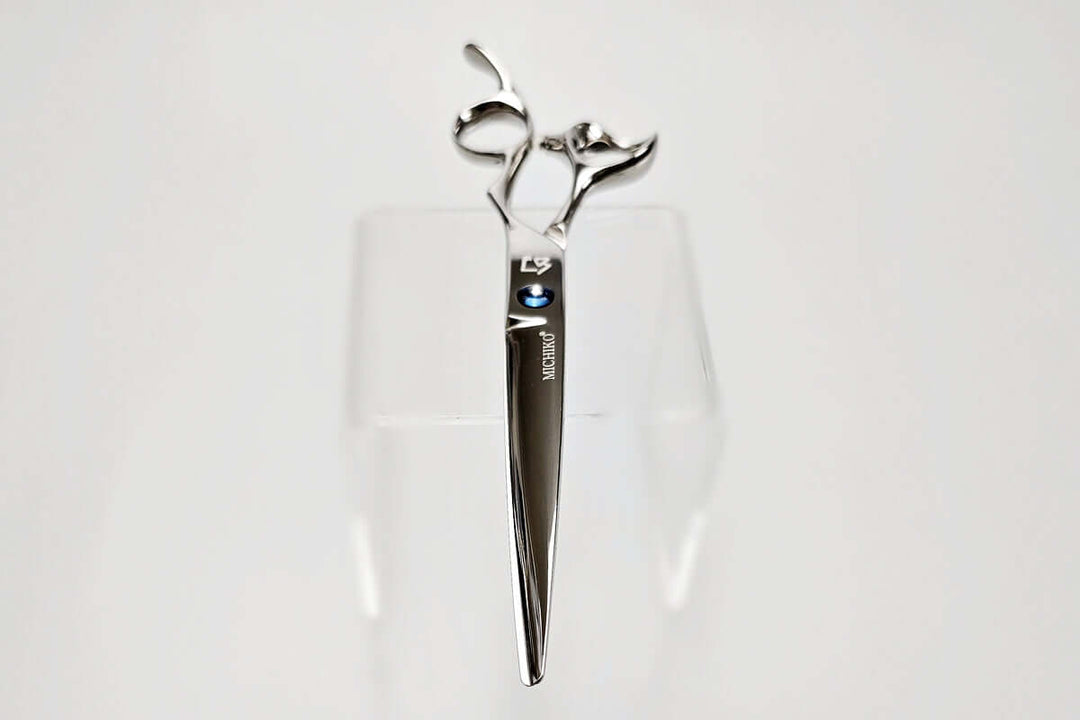 Hair cutting scissors with a brand logo on a white background