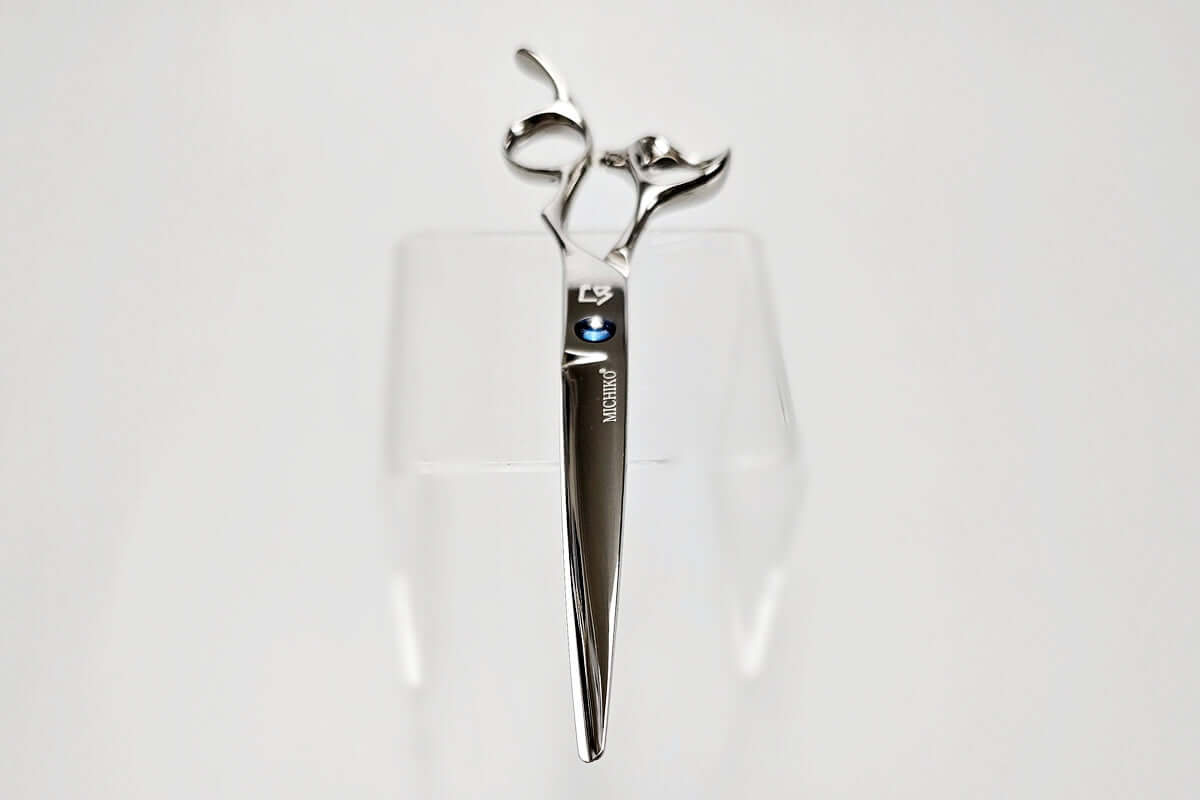 Hair cutting scissors with a brand logo on a white background