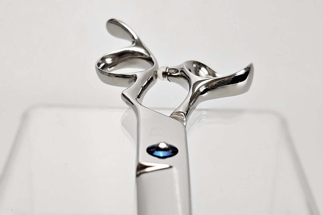 Close-up of hair scissors handle part on a white background