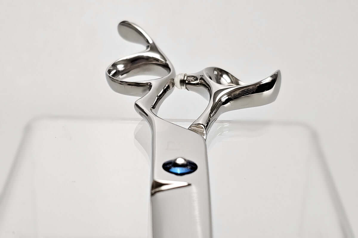 Close-up of hair scissors handle part on a white background