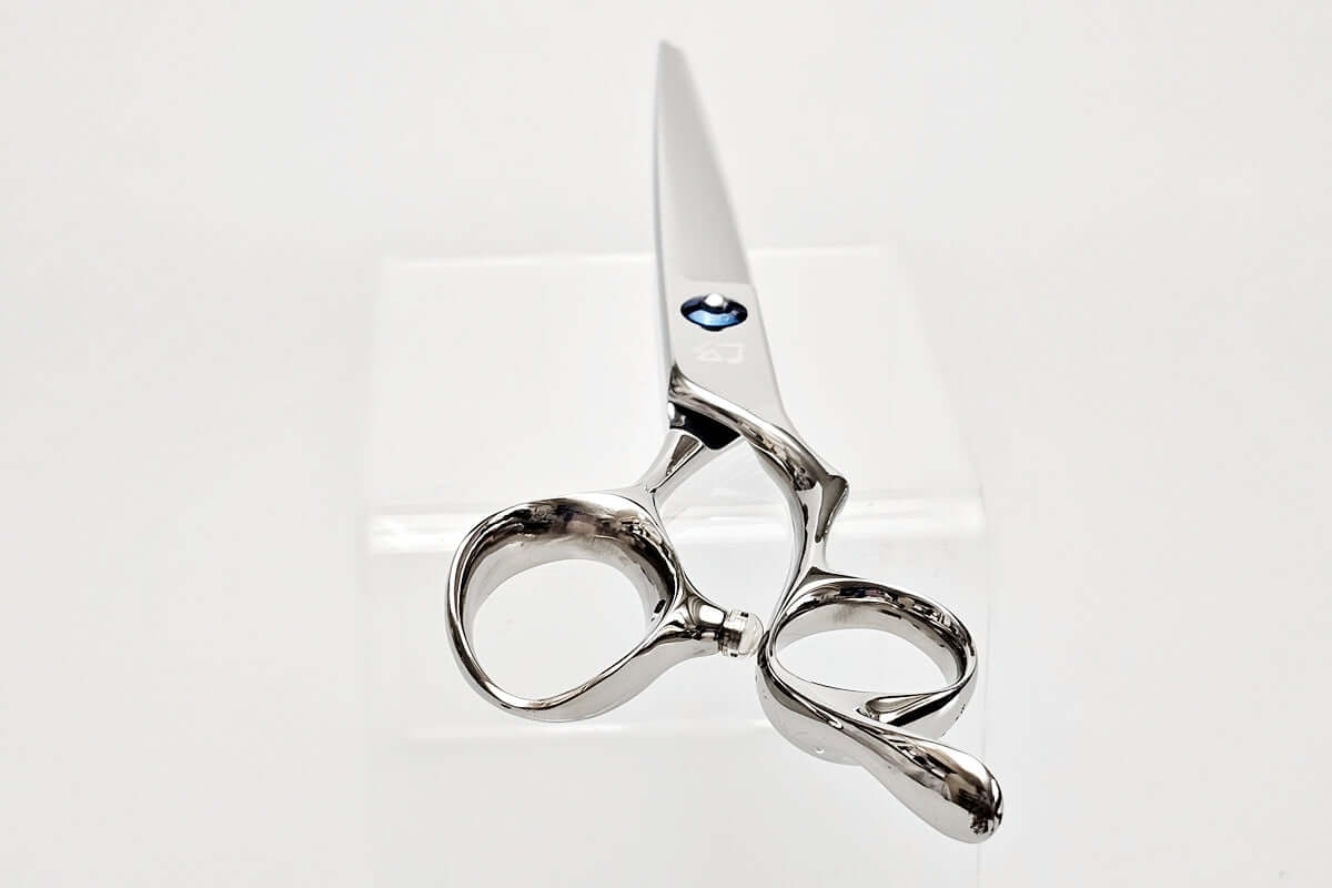 Silver scissors on a white background