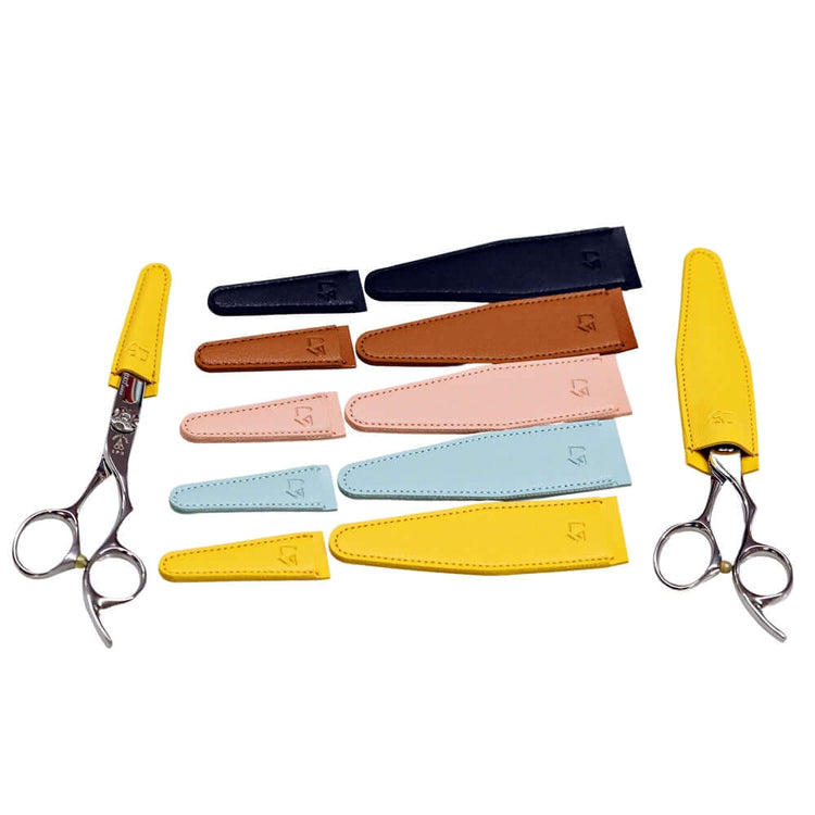 Small and large hair scissors tip covers in five colors (black, blue, pink, yellow, and brown), demonstrating usage with two scissors, each fitted with different size tip covers.